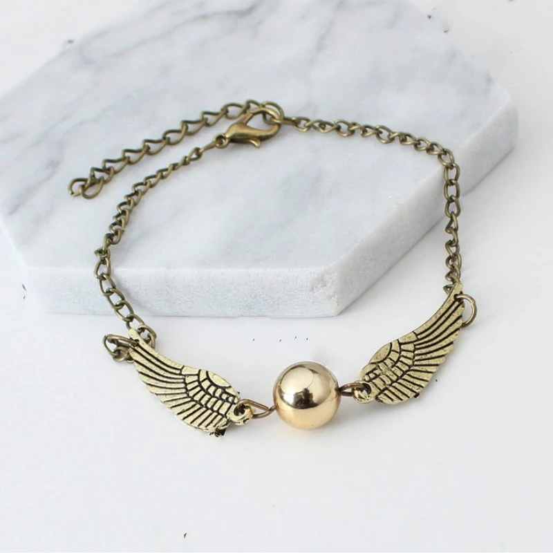 KARKÖTÉS Harry Potter Golden Snitch Deathly Hallows arany / ezüst